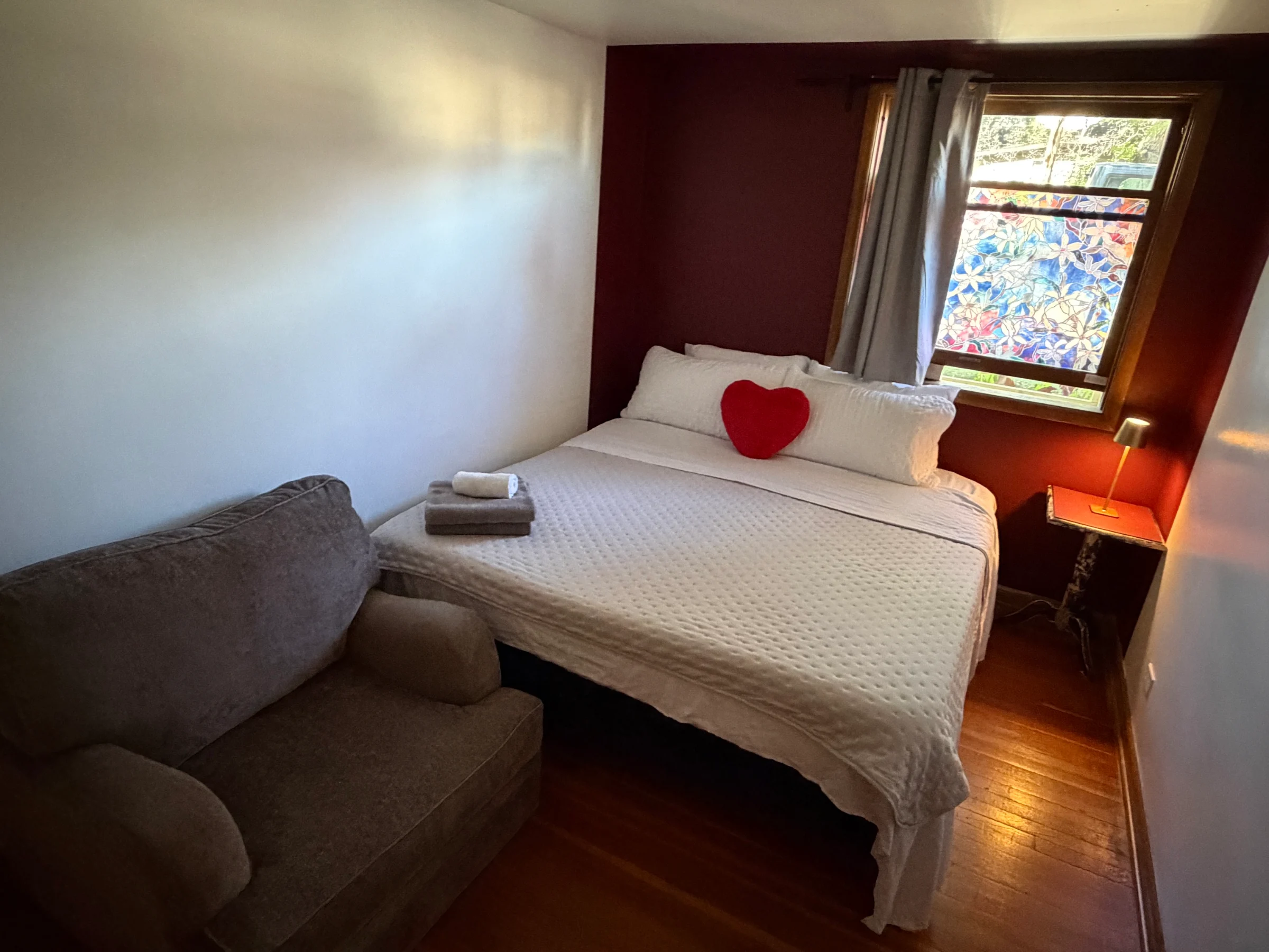 Shiraz Retreat suite with warm earthy textiles, king bed and soft window light